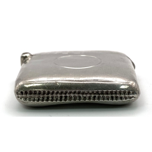 498 - An Antique Sterling Silver Vesta Case. Machine tooled decoration with empty cartouche. Hallmarks for... 