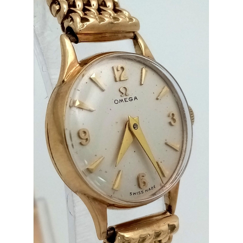 553 - A Vintage 9K Yellow Gold Omega Watch. 9k gold mesh bracelet. 9k gold case - 19mm. White dial. Mechan... 