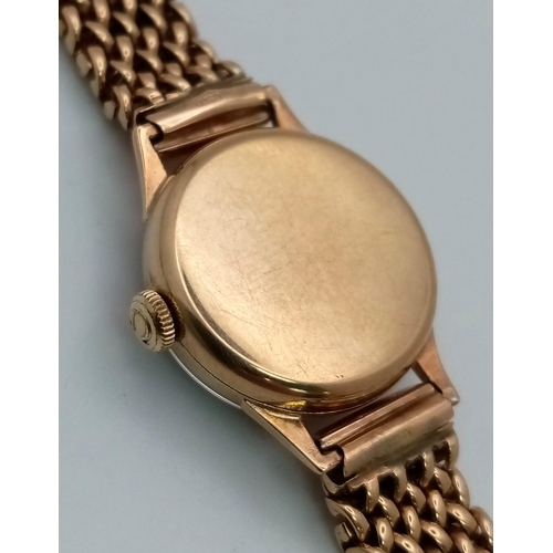 553 - A Vintage 9K Yellow Gold Omega Watch. 9k gold mesh bracelet. 9k gold case - 19mm. White dial. Mechan... 