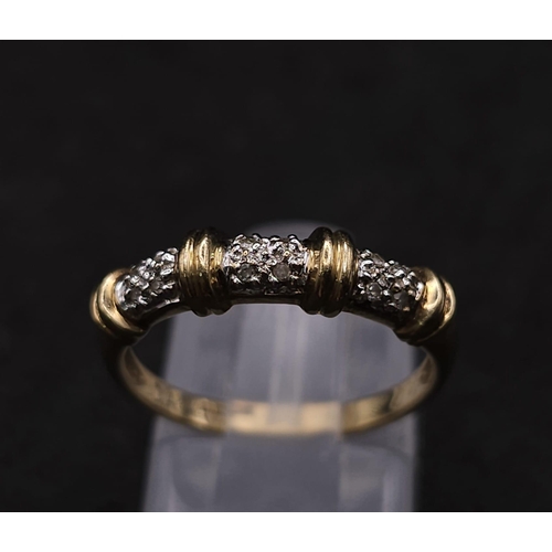 578 - A 9K GOLD AND DIAMOND DESIGNER RING .  1.8gms   size N