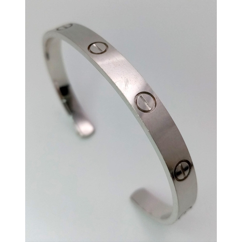 6 - A 18K WHITE GOLD CARTIER STYLE BANGLE 25.8G