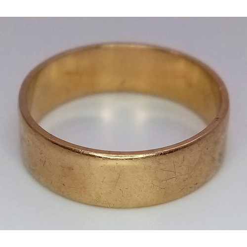 602 - A 9K GOLD BAND RING .  3.9gms   size R