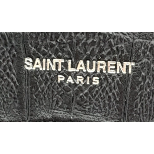 67 - A Saint Laurent Sac de Jour Handbag. Crocodile embossed leather exterior with silver hardware and de... 