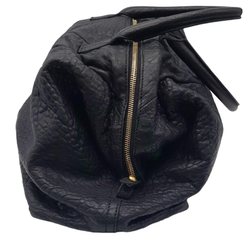 74 - An Yves Saint Laurent Black Easy Bag. Leather exterior with gold hardware, double zipper, and 5 prot... 