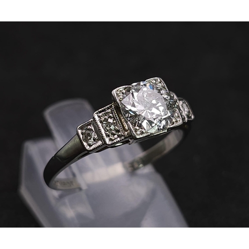 92 - A Beautiful Vintage 18K White Gold and Platinum Diamond Ring. Central, quality 0.75ct brilliant roun... 