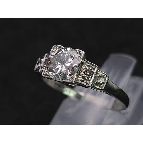 92 - A Beautiful Vintage 18K White Gold and Platinum Diamond Ring. Central, quality 0.75ct brilliant roun... 