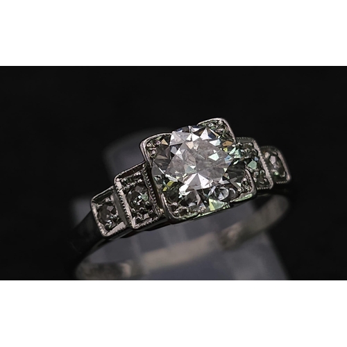 92 - A Beautiful Vintage 18K White Gold and Platinum Diamond Ring. Central, quality 0.75ct brilliant roun... 