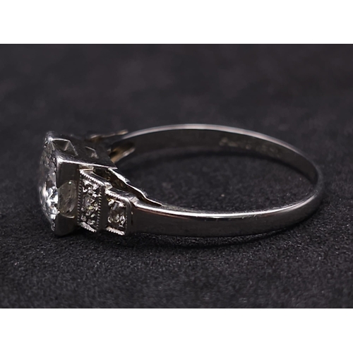 92 - A Beautiful Vintage 18K White Gold and Platinum Diamond Ring. Central, quality 0.75ct brilliant roun... 