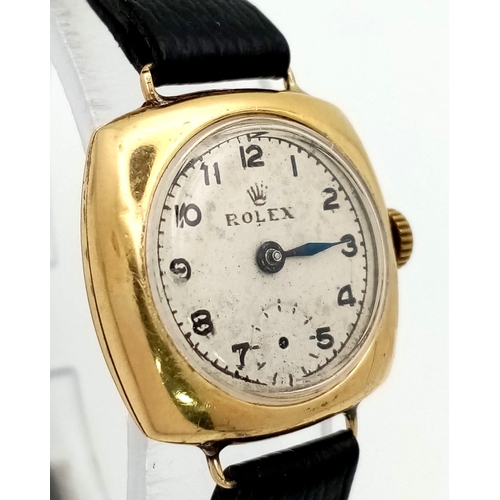 197 - A Rare Vintage (1950s) Rolex Ladies 18k Gold Mechanical Watch. Black leather strap. 18k gold square ... 