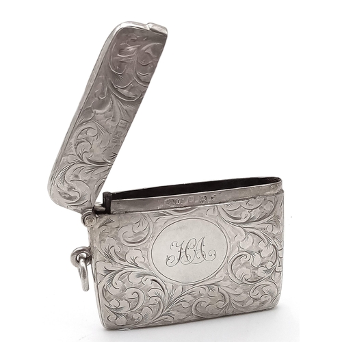 640 - An Antique Sterling Silver Vesta Case. Scrolled engraving with monogram cartouche. Hinge in working ... 