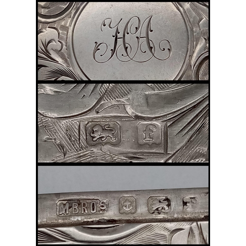 640 - An Antique Sterling Silver Vesta Case. Scrolled engraving with monogram cartouche. Hinge in working ... 