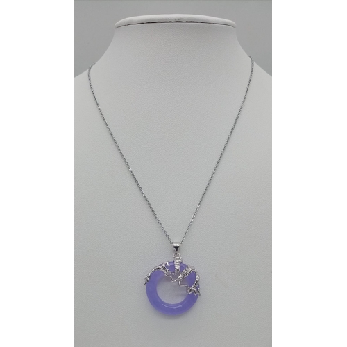 730 - A Lavender Jade Small Doughnut Pendant on a Disappearing 925 Silver Necklace. 22mm diameter. 44cm ne... 