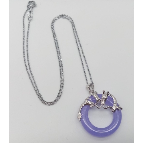 730 - A Lavender Jade Small Doughnut Pendant on a Disappearing 925 Silver Necklace. 22mm diameter. 44cm ne... 