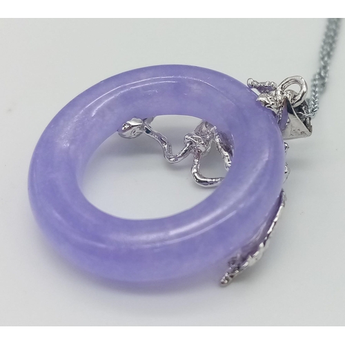 730 - A Lavender Jade Small Doughnut Pendant on a Disappearing 925 Silver Necklace. 22mm diameter. 44cm ne... 