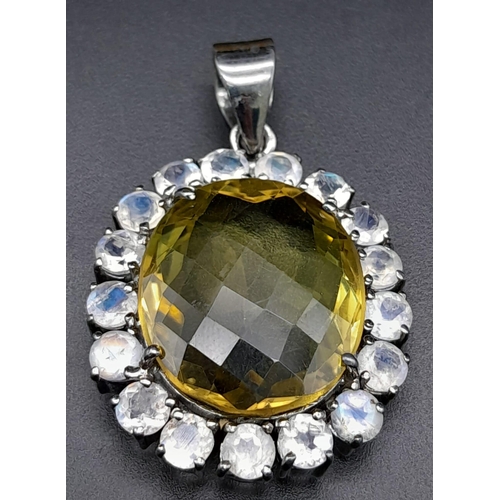 891 - An Oval-Cut Lemon Quartz and Moonstone Halo 925 Silver Pendant. Lemon - 21.40ct.  12.30g total weigh... 