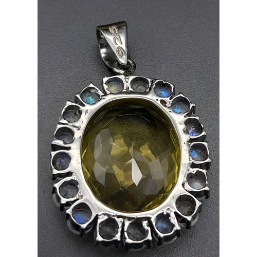 891 - An Oval-Cut Lemon Quartz and Moonstone Halo 925 Silver Pendant. Lemon - 21.40ct.  12.30g total weigh... 