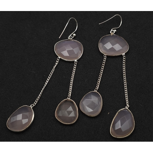 920 - A Pair of Rose Quartz 925 Silver Drop Earrings. Rose quartz - 50ctw. Drop 7cm. 13.10g total weight. ... 