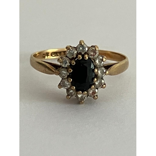 49 - 9 carat GOLD and SAPPHIRE RING. Comprising an oval SAPPHIRE set to centre with a clear White Gemston... 