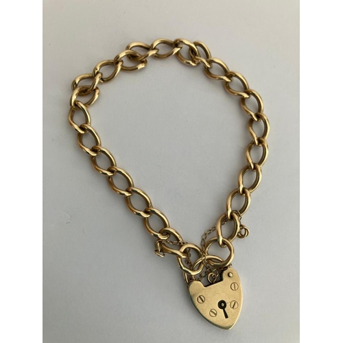 63 - 9 carat GOLD LINKED BRACELET complete with safety chain and GOLD  padlock fastening. Full UK hallmar... 