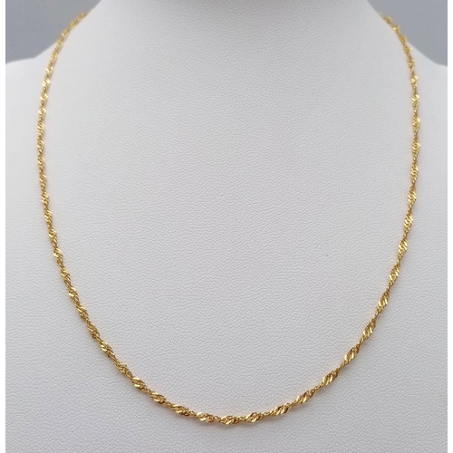 72 - A 42cms 22K GOLD TWIST NECK CHAIN .   3.6gms