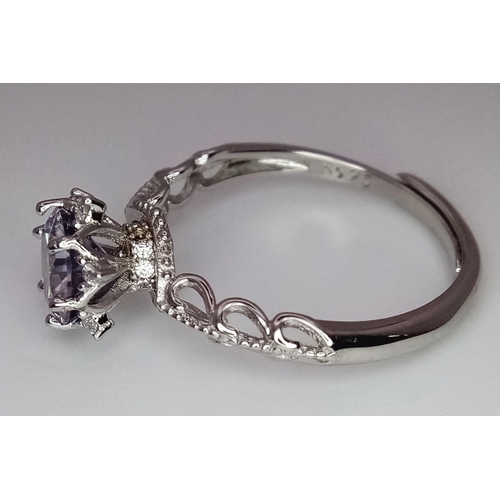 880 - An Unworn Sterling Silver Morganite and White Topaz Set Ring. 
Set with a centre (7mm Diameter) roun... 