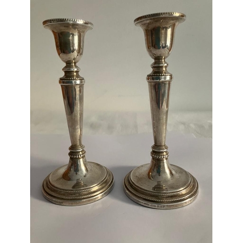 98 - Pair of Beautiful Tapered SILVER CANDLESTICKS having attractive gadroun detail. Condition new and un... 