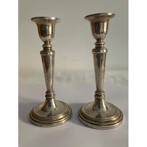 98 - Pair of Beautiful Tapered SILVER CANDLESTICKS having attractive gadroun detail. Condition new and un... 