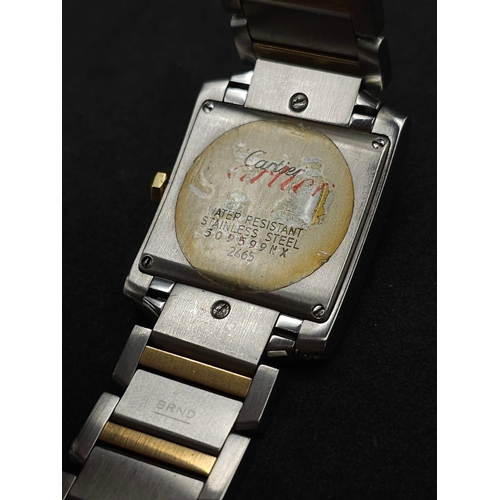 24 - Cartier 'Tank' Quartz Movement Ladies Watch.
Set with 30 diamonds on a 34mm face with a stainless st... 