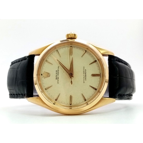 323 - A Vintage 18K Gold Rolex Oyster Perpetual Automatic Gents Watch. Black leather strap. 18k gold case ... 