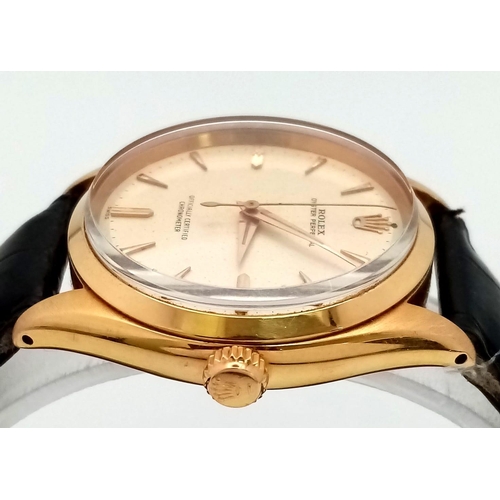 323 - A Vintage 18K Gold Rolex Oyster Perpetual Automatic Gents Watch. Black leather strap. 18k gold case ... 