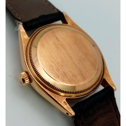 323 - A Vintage 18K Gold Rolex Oyster Perpetual Automatic Gents Watch. Black leather strap. 18k gold case ... 