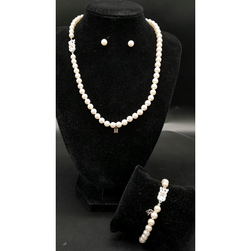 577 - An Elaborate Japanese Mikimoto Akoya Pearl Jewellery Set. A necklace, bracelet and pair of stud earr... 