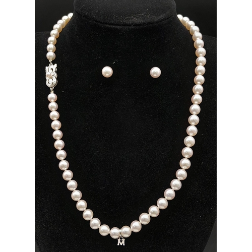 577 - An Elaborate Japanese Mikimoto Akoya Pearl Jewellery Set. A necklace, bracelet and pair of stud earr... 