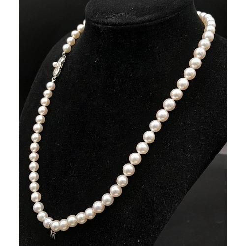 577 - An Elaborate Japanese Mikimoto Akoya Pearl Jewellery Set. A necklace, bracelet and pair of stud earr... 