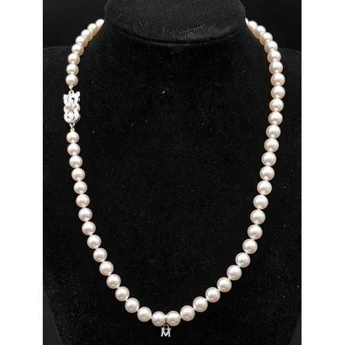 577 - An Elaborate Japanese Mikimoto Akoya Pearl Jewellery Set. A necklace, bracelet and pair of stud earr... 