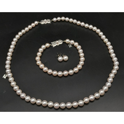 577 - An Elaborate Japanese Mikimoto Akoya Pearl Jewellery Set. A necklace, bracelet and pair of stud earr... 