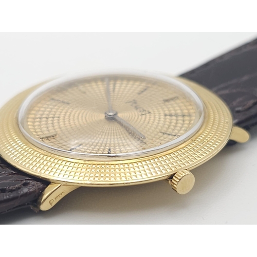 22 - A Vintage 18K Gold Piaget Gents Watch with Hypnotic Dial. Brown crocodile strap. 18k gold case - 30m... 