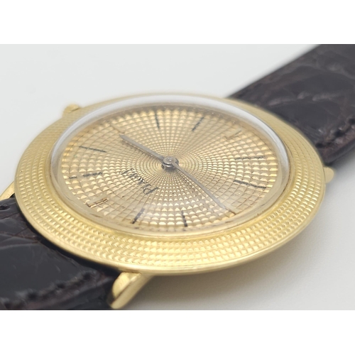 22 - A Vintage 18K Gold Piaget Gents Watch with Hypnotic Dial. Brown crocodile strap. 18k gold case - 30m... 