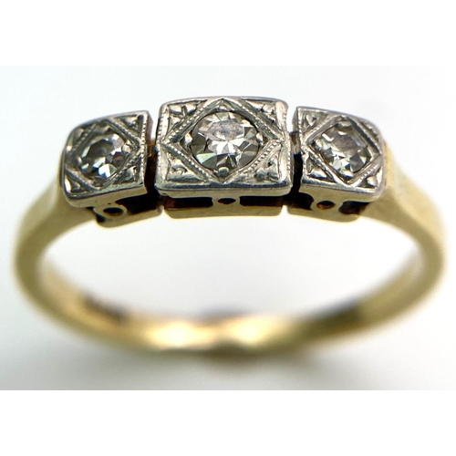 734 - A 18kt Yellow Gold Ring with Trio of Diamonds.
Each of the three Diamonds are mounted and framed bea... 