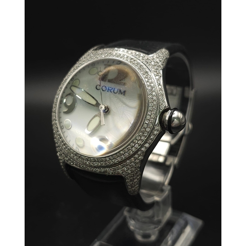 333 - A Corum Boutique Diamond Ladies Watch. Black leather strap. Stainless steel diamond encrusted case. ... 