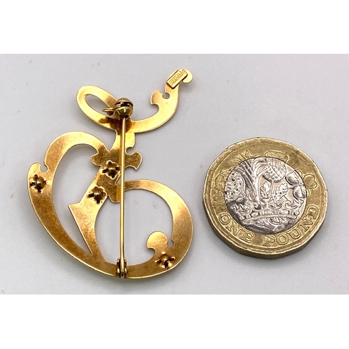 351 - A Vintage 18K Yellow Gold and Garnet Monogram Shaped Brooch. 4.5cm. 3.3g total weight.