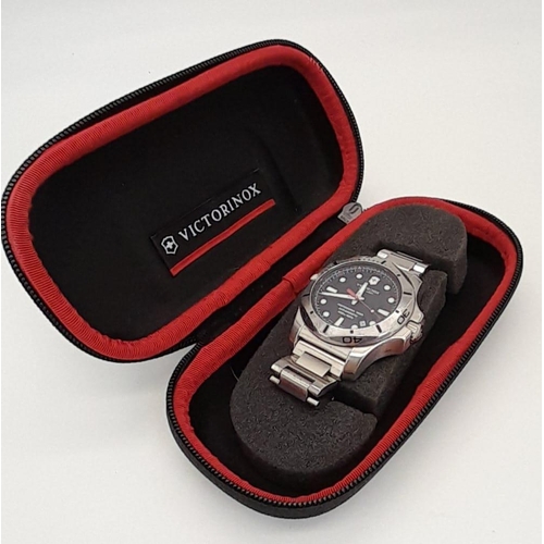 617 - A Victorinox Swiss Army Gents Watch. Stainless steel bracelet and case - 46mm. Black dial with date ... 