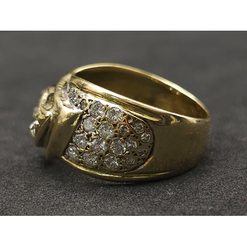 933 - An 18kt Yellow Gold Ring with a duo of Round Cut Diamonds on one side, offset by a pavement of diamo... 