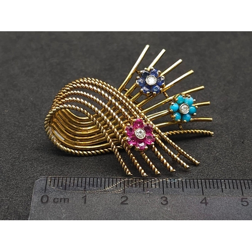 954 - A 18kt Yellow Gold Woven Design Floral Brooch.
Features three diamond centred flowers, which consist... 