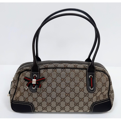 113 - Gucci Princy Bag beige/brown. GG monogram patterning, quality leather with gold tone hardware. Comes... 