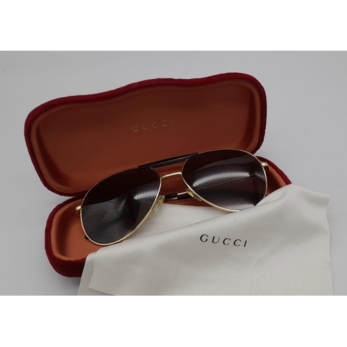 169 - Gucci Sunglasses with Gold and Dark Tortoiseshell Havana frame. Solid brown lens, the pinnacle of It... 