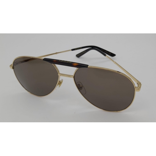 169 - Gucci Sunglasses with Gold and Dark Tortoiseshell Havana frame. Solid brown lens, the pinnacle of It... 