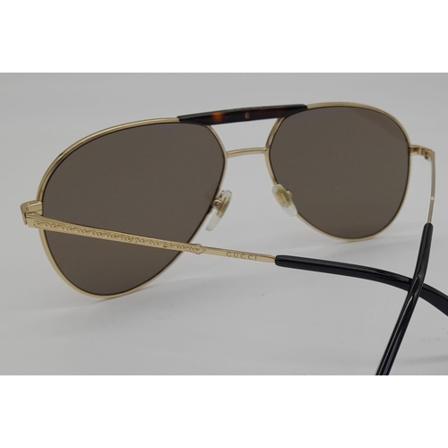 169 - Gucci Sunglasses with Gold and Dark Tortoiseshell Havana frame. Solid brown lens, the pinnacle of It... 