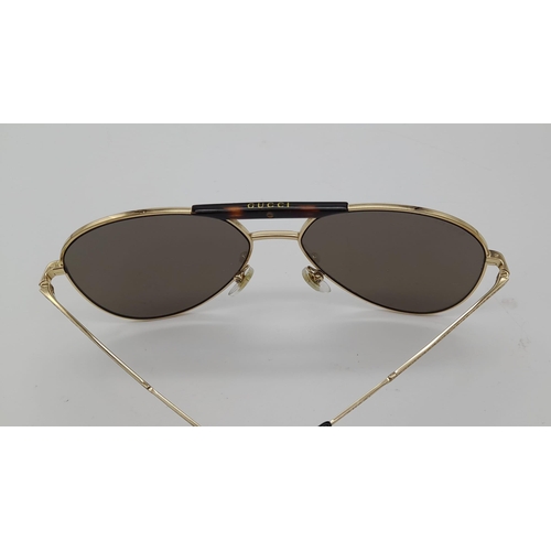 169 - Gucci Sunglasses with Gold and Dark Tortoiseshell Havana frame. Solid brown lens, the pinnacle of It... 