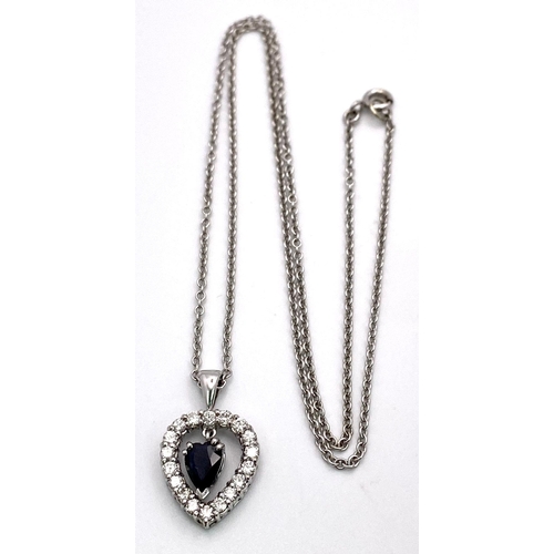 519 - A VERY PRETTY SAPPHIRE AND DIAMOND PENDANT ON A 9K WHITE GOLD 45cms CHAIN .   6.4gms    13075